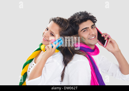 indian holi Festival Couple talking phone Stock Photo