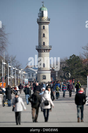 Rostock-Warnemuende, Germany. 25th Feb, 2014. The sunny weather drew many people out onto the beach promenade in Rostock-Warnemuende, Germany, 25 February 2014. Photo: Axel Heimken/dpa/Alamy Live News Stock Photo