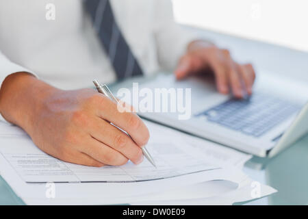 Close up on businessmans hands working Stock Photo