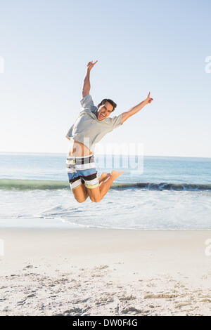 Energetic handsome man jumping Stock Photo