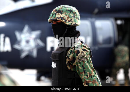 Mexico City, Mexico. 22nd Feb, 2014. A Mexican Navy soldier guards a street in Mazatlan, Sinaloa, Mexico, on Feb. 22, 2014. The head of Mexico's Sinaloa Cartel Joaquin Guzman Loera, alias as ''El Chapo Guzman'' who is considered by the United States as one of the most powerful drug lords in the world, was captured by Mexican and U.S. authorities in Mexican territory, according to local press. © Jair Cabrera Torres/NurPhoto/ZUMAPRESS.com/Alamy Live News Stock Photo