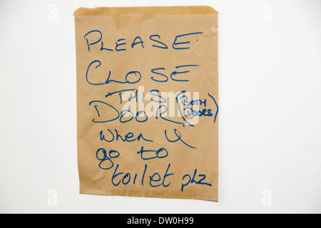 Close door sign on toilet door Stock Photo
