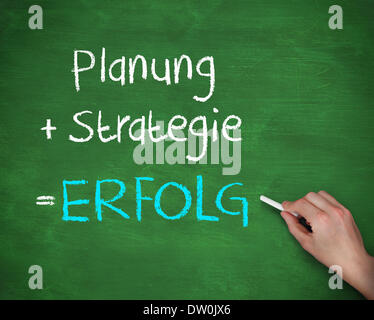 Man writing planung strategy and erfolg Stock Photo