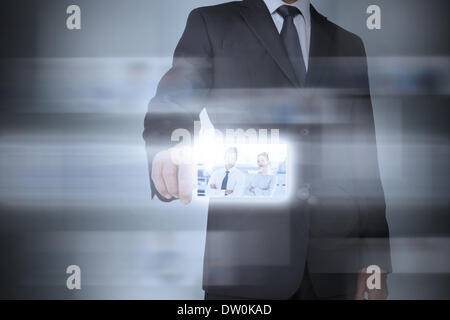 Stylish businessman using futuristic interface Stock Photo