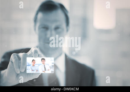 Businessman presenting digital interface Stock Photo