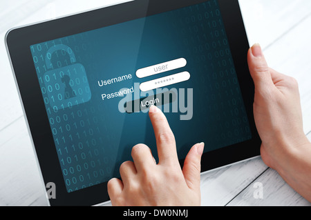 Female hands using tablet pc protected with password Stock Photo