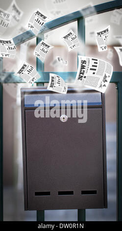 Post box with daily newspapers flying Stock Photo