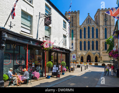 La Brasserie restaurant on historic Kirkgate in the town centre looking towards Cathedral, Ripon, North Yorkshire, England, UK Stock Photo