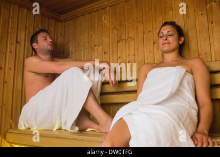 Happy couple relaxing in a sauna Stock Photo