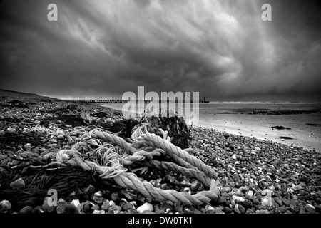 Storm clouds rage over the south coast at Climping Beach near Littlehampton in West Sussex as yet another low pressure system ra Stock Photo