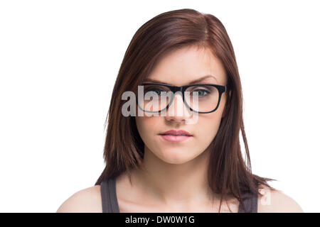 Serious young woman wearing glasses posing Stock Photo