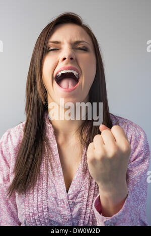 Victorious stylish brunette posing Stock Photo