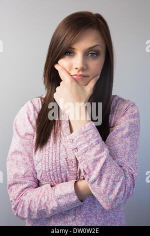 Pensive classy brunette posing Stock Photo