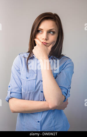 Pensive serious brunette posing Stock Photo