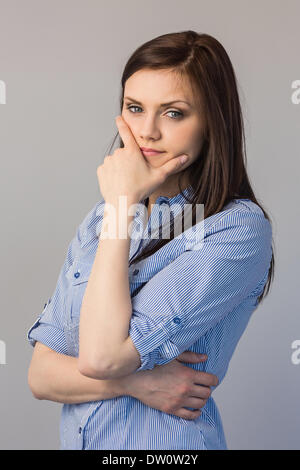 Pensive pretty brunette posing Stock Photo