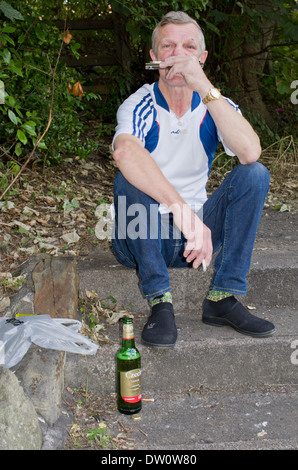 male middle aged playing music in public place Stock Photo