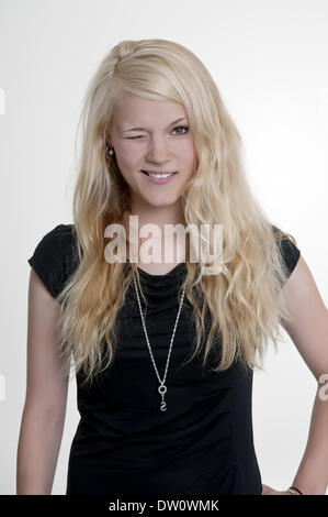 young woman winking with one eye Stock Photo