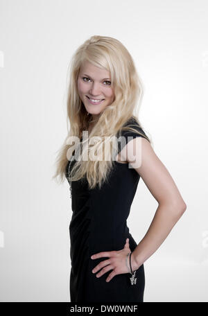 young woman in black dress Stock Photo