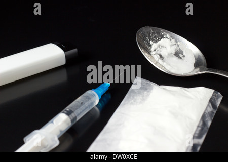 cooked heroin with syringe and lighter Stock Photo