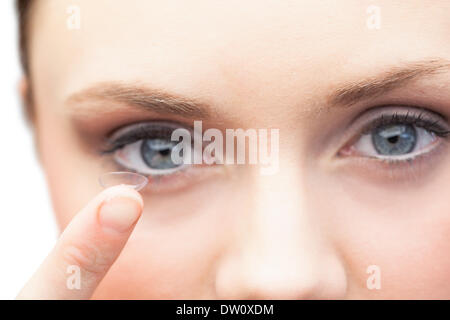 Pretty model holding contact lens Stock Photo
