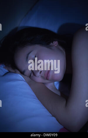 Young asian woman sleeping happily at night Stock Photo