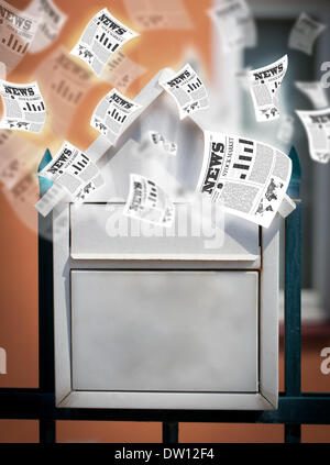 Post box with daily newspapers flying Stock Photo