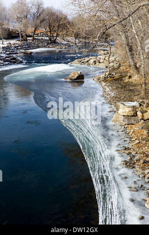 Ice on the Arkansas RIver which runs through the downtown historic district of the small mountain town of Salida, Colorado, USA Stock Photo