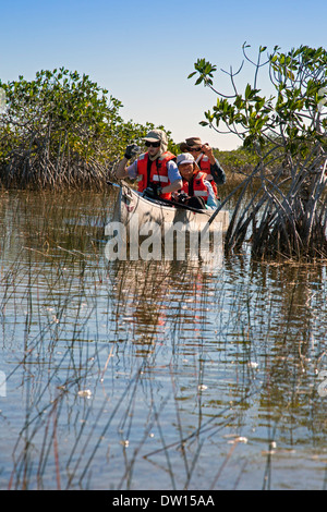 Everglades National Park, Florida - Visitors paddle canoes on a trip led by a park ranger. Stock Photo