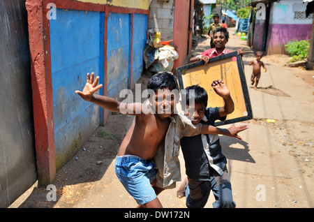 Children on the street in poor neighborhood of Kollam, Kerala, India Stock Photo