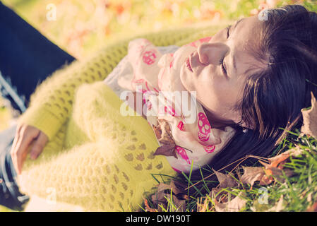 Woman laying in grass Stock Photo