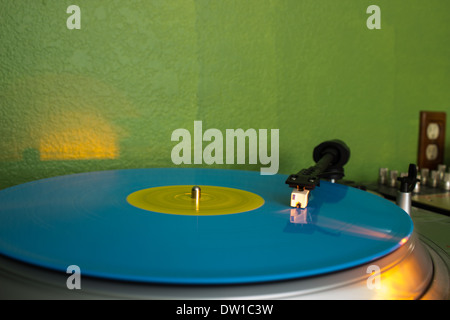 DJ turntable with a record spinning on it. Stock Photo