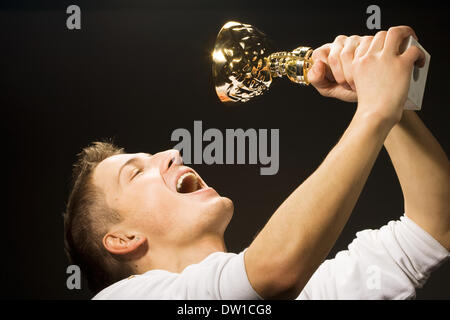 man is glad the won cup Stock Photo