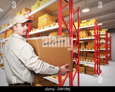 delivery man in warehouse Stock Photo