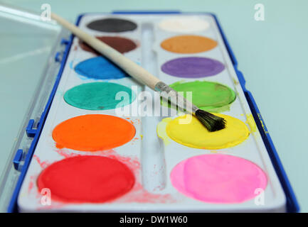 set of water-colour paints and brush Stock Photo