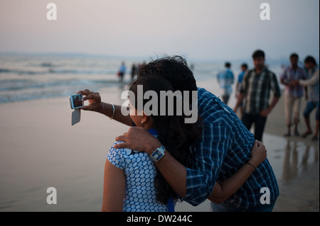 This couple taking a selfie along Juhu beach in Mumbai India. Stock Photo