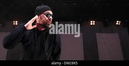 Rostock, Germany. 25th Feb, 2014. German rapper Sido performs onstage during his first concert of his tour of Germany, in Rostock, Germany, 25 February 2014. Photo: Axel Heimken/dpa/Alamy Live News Stock Photo