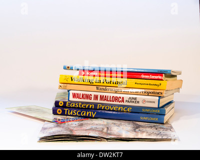 Map and stack of books for hikes in different European countries, available in many languages Stock Photo