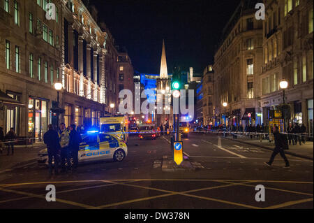 London, UK. 25th February 2014. Metropolitan Police officers and London Ambulance crews in action after a cyclist is critically injured during a collision on Regent Street, North of Oxford Circus.       Credit:  Pete Maclaine/Alamy Live News Stock Photo