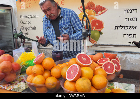 Man selling fresh fruit juice in Safed Israel Stock Photo