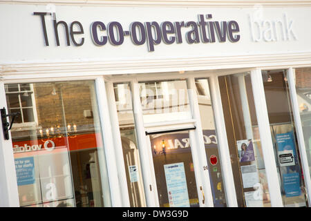 Chichester, UK. 26th February 2014. The  Co-operative group with £2bn losses for 2013 are actively looking to sell off their farms and pharmacies. Chichester high street, West Sussex © Alamy / Rob Wilkinson 2014 Credit:  Rob Wilkinson/Alamy Live News Stock Photo