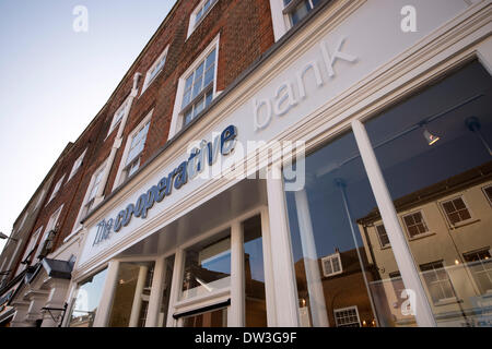 Chichester, UK. 26th February 2014. The  Co-operative group with £2bn losses for 2013 are actively looking to sell off their farms and pharmacies. Pictured: The Co-opeartive bank branch on Chichester high street, West Sussex Credit:  Rob Wilkinson/Alamy Live News Stock Photo