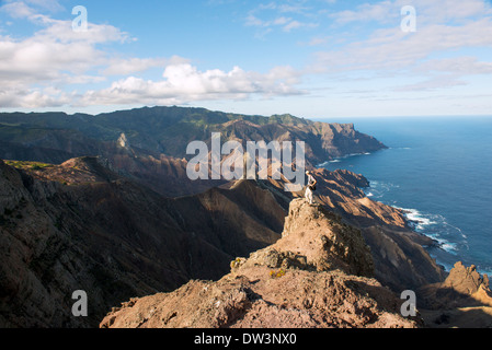 Hiker admires the view on the island of St Helena in the south Atlantic there are many hiking trails and walks on the island Stock Photo