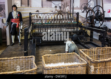 Child laborer working at Mule Jenny, semi-automatic spinning machine, MIAT, industrial archaeology museum, Ghent, Belgium Stock Photo