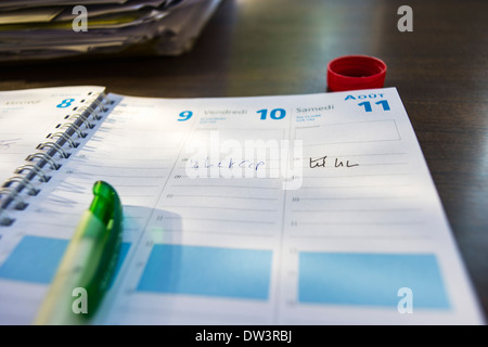 Desk diary with a pen Stock Photo