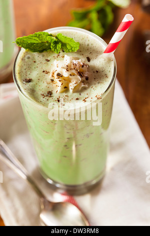 Cold Refreshing Mint Chocolate Chip MilkShake with a Straw Stock Photo