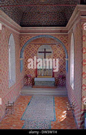 Moorish patterns on the ceiling and mosaic patterns on the floor adorn the 15th century private Chapel of Sintra National Palace Stock Photo