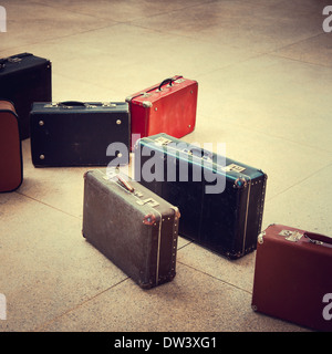 group of vintage suitcase on tiled floor Stock Photo