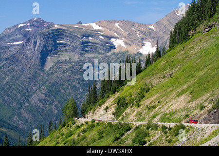 Red Jammer bus on the Going-to-the-Sun Road in Glacier National Park, Montana, USA. Stock Photo