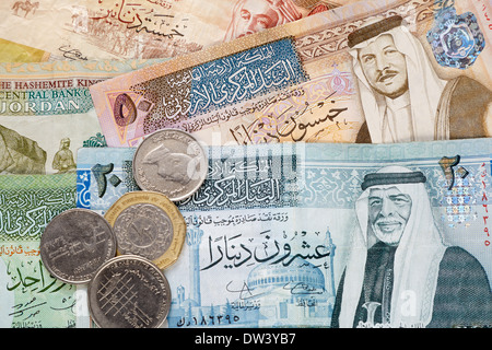 Jordanian dinar banknotes and coins background Stock Photo