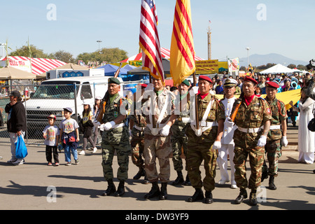 South Vietnamese military members parade their former  flag along side the American flag at the Tet Festival  California Stock Photo